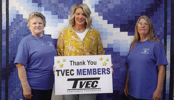 The Trinity Valley Electric Cooperative (TVEC) Charitable Foundation recently awarded a $2,000 grant to the Texas Star Quilters Guild. This year’s raffle quilt was the ‘Blue Lily.’ Pictured were Janet Cole, left, and Cathy Anderson, right, the creators of the ‘Blue Lily.’ Also shown was Kari Wilmeth from TVEC. Not pictured was Cathy McCoy, the quilter. Raffle tickets can be purchased at the Van Zandt County/Sarah Norman Library. Story on 8A. Courtesy photo