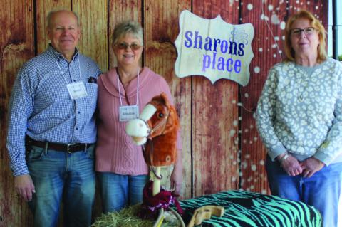 Founders of Sharon’s Place Kevin Tanzillo (from left), Kristine Tanzillo and Board member Annette Gaar standing in the Sharon’s Place photo booth at the No Limits County Fair March 28. This was a special day at the Van Zandt County Livestock Show and Fair for developmentally and physically challenged individuals. Photo by Carla Gray