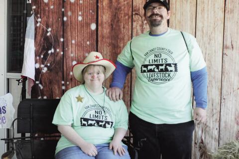 Lacey Williams (left) and Bryan Fain visit the photo booth at the No Limits Livestock Experience held during the Van Zandt County Livestock Show and Fair March 28. Sharon’s Place, a nonprofit organization, created the photo booth for fair goers. Photos by Carla Gray