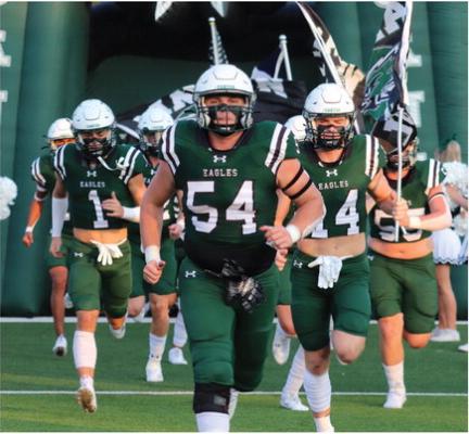 Jonathan Berry (54) leads the Canton Eagles onto the field at Norris Birdwell Stadium prior to kicking off their 2023 regular season Aug. 25 against the Mineola Yellowjackets. The Eagles exploded for 28 first quarter points on their way to a 33-12 victory over Mineola. Canton will visit Winnsboro in a 7:30 p.m. kickoff Friday, Sept. 1. Photos by Lianna Reed