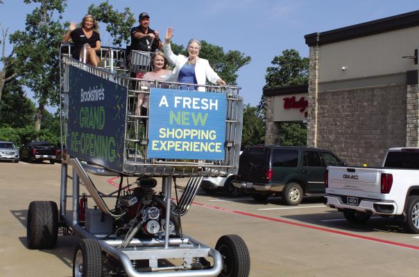 Several in attendance received free rides in an oversized motorized shopping cart located in the Brookshire’s Canton parking lot June 12. The store was celebrating its Grand Re-Opening. Among those receiving rides around the parking lot were Canton Mayor Lou Ann Everett, Canton Texas Chamber of Commerce Chief Executive Officer (CEO) Kelli Ridgway and Van Zandt Newspapers L.L.C. Advertising Manager Karla Dunson. Additional photos on 2A. Photo by David Barber