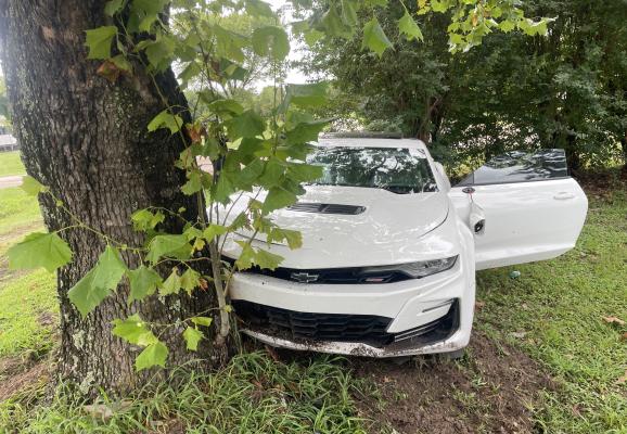 A stolen white camaro struck a tree at the conclusion of a high-speed chase that occurred in Van Zandt County July 18. The vehicle struck the tree at 110 VZCR 3442. Three suspects fled from the vehicle. The two passengers were arrested but the driver of the vehicle remains at large, according to VZC Pct. 3 Constable Jeff Caughron. Courtesy photo