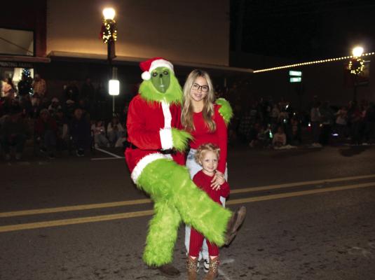 ‘The Grinch’ was among the many visitors that participated or observed The Hard Candy Christmas Parade and Festival sponsored by Canton Main Street Dec. 13. There were 70 entries that went through the parade route downtown. Photo by Susan Harris