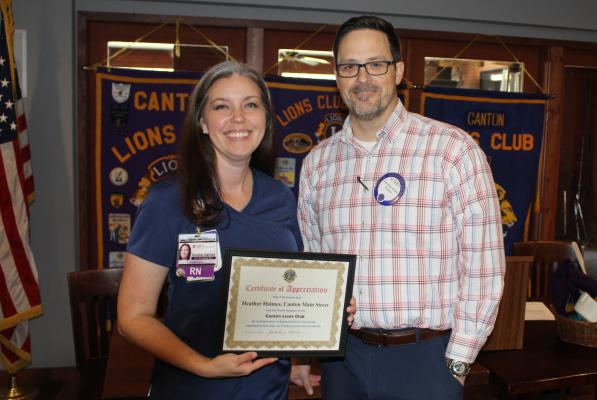 A ‘Certificate of Appreciation’ was presented to Canton Main Street Board Member Heather Haimes Oct. 2 following her presentation at the weekly Canton Lions Club Luncheon at the Van Zandt Country Club. Presenting the certificate was Canton Lions Club President Jonathan Helvey. Photo by David Barber