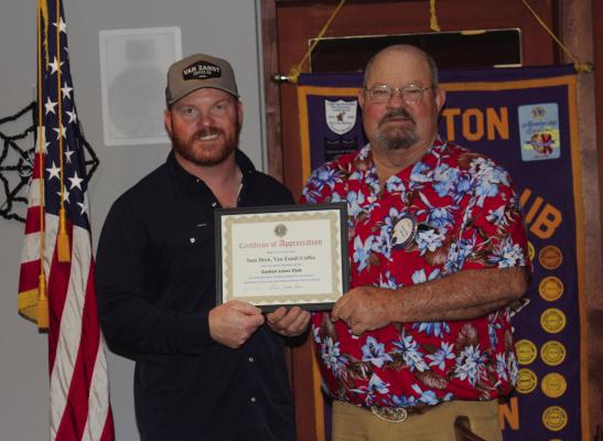 Sam Deen, left, was presented a ‘Certificate of Appreciation’ Oct. 22 following his speech during the weekly Canton Lions Club Luncheon at Van Zandt Country Club. Presenting the certificate was Canton Lions Club President Sandy Sims. Deen, the owner of Van Zandt Coffee, discussed his passion for coffee through the years. Photo by Susan Harris