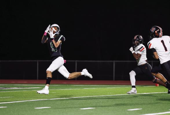 Ethan Lewis, the Canton Eagle wide receiver, makes an over the shoulder catch for a touchdown Oct. 23 against the Ferris Yellowjackets. Lewis caught five passes for 119 yards and two TD’s as the Eagles swatted Ferris, 58-15. Photos by Don Johnson