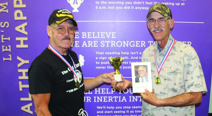 Tony Barber of Fort Worth, right, the son of the late Liston Barber of Martins Mill, received a trophy and medal from ‘The Old Timers Club’ Promoter David Marlowe during a special recognition held in memory of their oldest club member April 12 at Anytime Fitness in Canton. Photo by David Barber