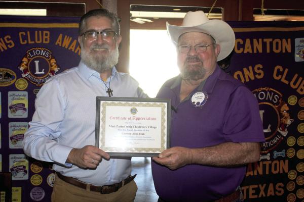 A ‘Certificate of Appreciation’ was presented to Children’s Village of Texas Program Administrator Matt Patton, left, following his presentation April 8 at the Canton Lions Club Weekly Luncheon April 8 at the Van Zandt Country Club. Presenting the certificate was Canton Lions Club President Sandy Sims. Photo by David Barber