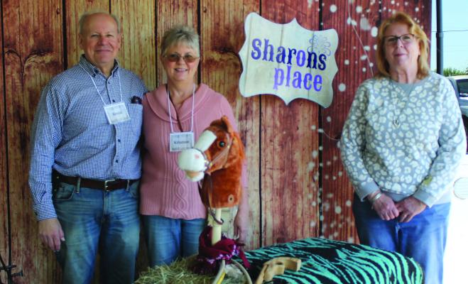 Founders of Sharon’s Place Kevin Tanzillo (from left), Kristine Tanzillo and Board member Annette Gaar standing in the Sharon’s Place photo booth at the No Limits County Fair March 28. This was a special day at the Van Zandt County Livestock Show and Fair for developmentally and physically challenged individuals. Photo by Carla Gray