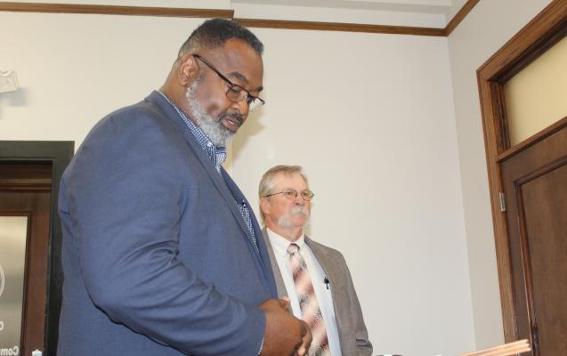 Texas A&M AgriLife Extension Service District Extension Administrator Hurley Miller (foreground) introduced new Van Zandt County Extension Agent Leon Watson Oct. 9 during the regular meeting of the VZC Commissioners Court. Photo by David Barber