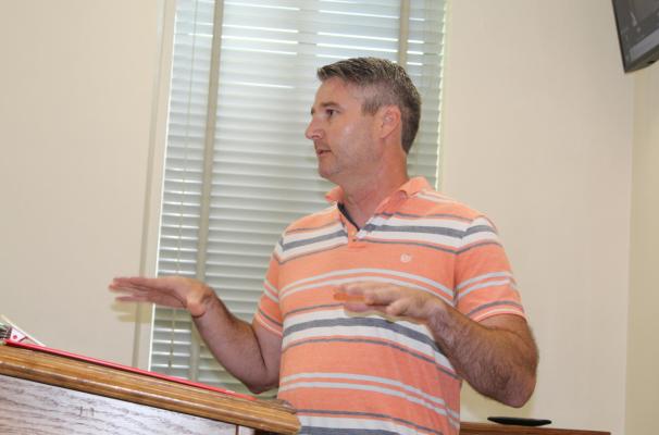 Wood County Asphalt Company Business Operations Manager Kyle Talley of Longview visited with the VZC Commissioners Court July 20 to request an adjustment in their bid price regarding D-mix/oil sand. The request was approved in a 3-0 vote by the commissioners’ court. Photo by David Barber