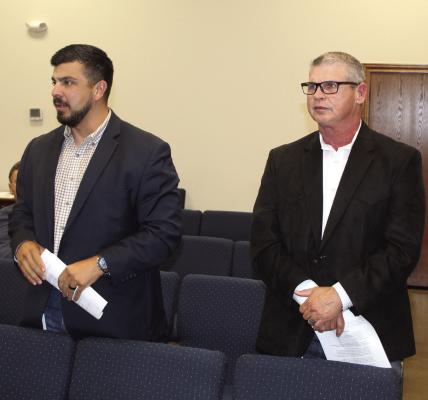 Uriel De La Fuente of ONCOR, left, introduced ONCOR Distribution Operations Supervisor Brandon Arthur to the members of the Canton City Council April 21 during the council’s regular monthly meeting at Canton City Hall. Photo by David Barber