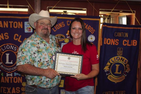 A ‘Certificate of Appreciation’ was presented to ‘Sleep in Heavenly Peace’ East Texas Co-President Kari Gerner April 15 following her presentation at the weekly Canton Lions Club Luncheon. The certificate was presented by Canton Lions Club President Sandy Sims. At the conclusion of their April 15 luncheon, the Canton Lions Club agreed to make a $500.00 donation to the organization. Photo by David Barber