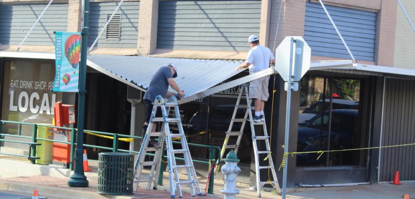 Repair work begins on awning