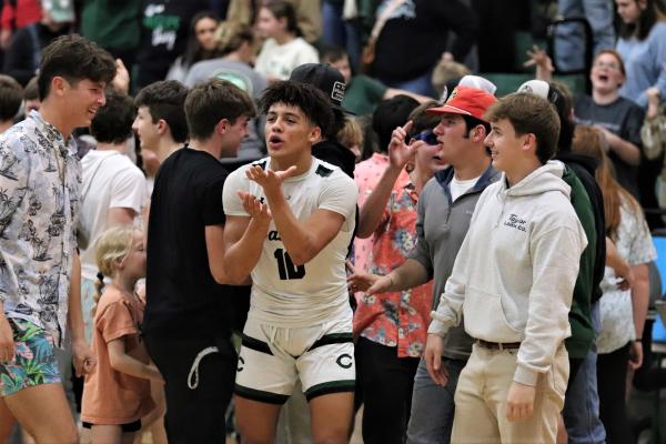Chantson Prox wishes farewell to Brownsboro students following the Eagles thrilling 52-49 victory on Feb. 3. Prox finished the night with 14 points, including the game-winning free throws. Photo by Lianna Reid