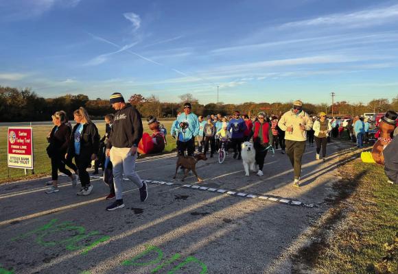 A huge crowd of runners braved the elements Thanksgiving Day morning (Nov. 23) to compete in the 10th annual ‘Turkey Trot’ in Canton. Temperatures had dropped into the 30s when the race began at 7:30 a.m. Proceeds from the shirt sales went to Mallory’s Heart Foundation. Courtesy photo