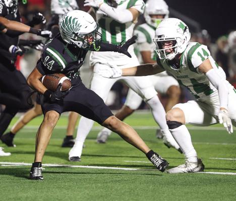 Canton Eagle defensive back Jayden Lopez (dark uniform) looks for running room as he returns a Mabank turnover Sept. 19. For the second week in a row, the undefeated Eagles registered a shutout as they blew past Mabank, 47-0. The Eagles will complete their non-district schedule Friday, Sept. 26 with a 7:30 p.m. kickoff at Rusk. Photo by Don Johnson