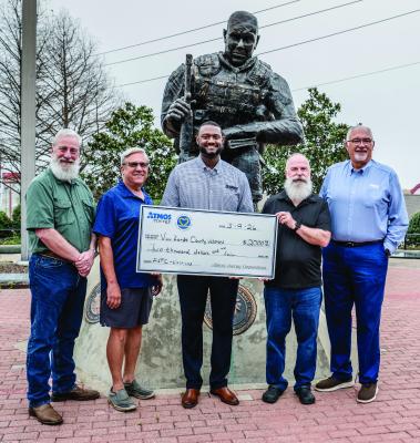 The Van Zandt County Veterans Memorial was recently honored with a donation for their scholarship program from Atmos Energy. Atmos Energy has been a supporter of the VZC Veterans Memorial for 12 years. Shown were left to right, Harry Fontenot, VZC Veterans Memorial Board Secretary; Dan Maucieri, VZC Veterans Memorial Board Treasurer; Phillip Burley of Atmos Energy; John Norwood, VZC Veterans Memorial Scholarship Committee; and Darwin Winfield of Atmos Energy. Photo by Faith Caughron