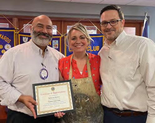 Rebecca Helvey, the Renaissance Southpaw, was the guest speaker May 8 during the weekly Canton Lions Club Luncheon at Van Zandt Country Club. Presenting the guest speaker with a ‘Certificate of Appreciation’ were Canton Lions Club President Jesse Carranza, far left, and Canton Lions Club Member Jonathan Helvey. Courtesy photo