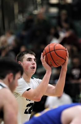 Senior Layne Etheridge knocks down a free throw in overtime against Sunnyvale, one of his 15 points on the night. Photo by Lianna Reid
