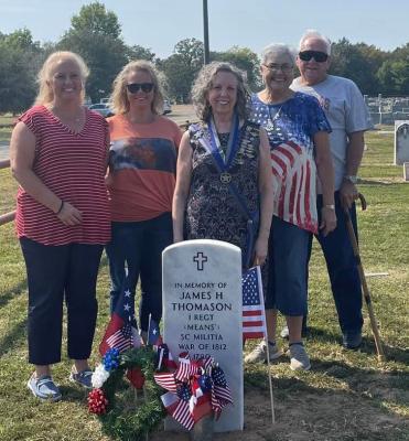 Sherrie Merrill, Jana Dennie, Kay Tatum, Jan and Bill Crow pose by the newly-marked grave of their ancestor. Courtesy photo
