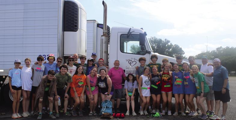 Members of the Memorial Drive United Methodist Church of Houston youth mission team stand with member of Love and Grace Family Resource in Canton following the youth group’s recent assistance. The Houston youth mission visited Canton during the week of June 6-10. Photo by Susan Harris