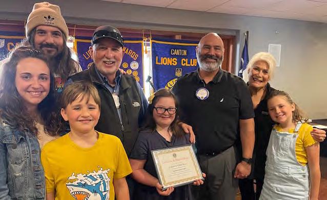 Shown were left to right, Tiffani Reese, Conrad Reese, Bob Reese, Emerson Reese, Eliot Reese, Jesse Carranza, Connie Reese, Frances Reese. Conrad and Tiffani were the guest speakers April 3 during the regular weekly Canton Lions Club Luncheon. Presenting a ‘Certificate of Appreciation’ is Canton Lions Club President Jesse Carranza. Courtesy photo