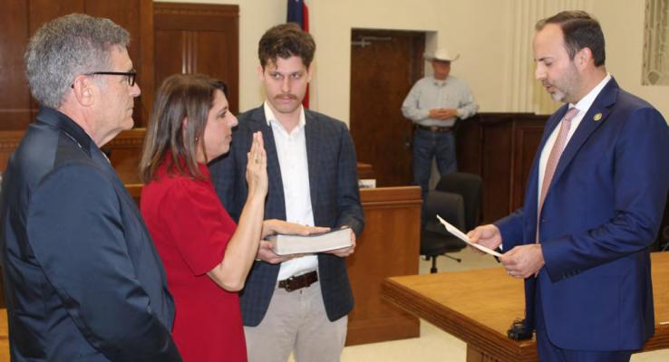 Newly elected Texas House District 2 State Representative Jill Dutton of Van takes the oath of office administered by United States District 5 Congressman Lance Gooden of Terrell Feb. 14 during a swearing-in ceremony in the Van Zandt County District Courtroom in Canton. Standing with Dutton were her husband, David, and her son, D. J. Photo by David Barber