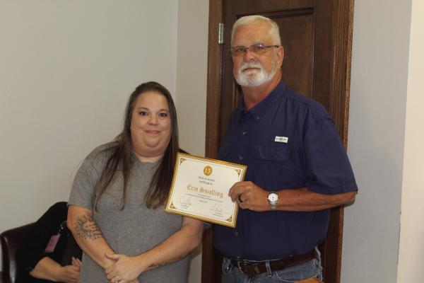 Erin Smalling was recognized for her 15 years of service in the Van Zandt County Maintenance Department by the VZC Commissioners’ Court during its regular meeting July 30. Presenting a ‘Certificate of Appreciation’ to Smalling was VZC Maintenance Supervisor Cris Burnett. Photos by David Barber
