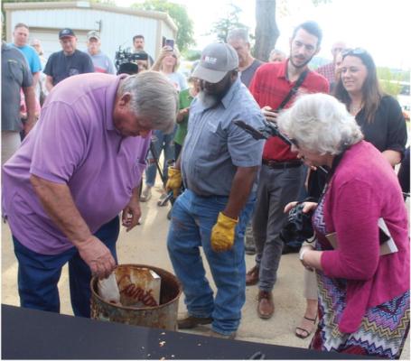 City of Canton Manager Lonny Cluck was among a number of individuals checking out the contents of a time capsule that was recently discovered by a City of Canton worker. The capsule, buried in 1973, was unveiled Sept. 11 during a special ceremony at the Historic First Monday entrance on Groves Street. Photo by David Barber