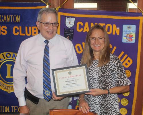 At the conclusion of the regular weekly luncheon meeting of the Canton Lions Club July 19 at the Van Zandt Country Club, Van Zandt County Judge and Canton Lions Club member Andy Reese was presented a ‘Certificate of Appreciation’ from Canton Lions Club Vice-President Tonda Curry. Reese was the guest speaker at the luncheon on his 200th day in office as VZC judge. Photo by David Barber