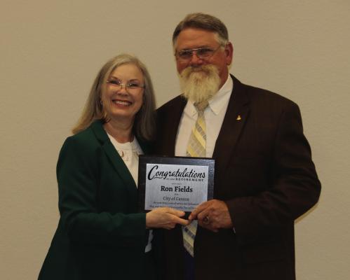 Retiring City of Canton employee Ron Fields was recognized by the Canton City Council for his 17 years of service to the city during the regular monthly meeting of the Canton City Council March 19. Presenting Fields with an appreciation plaque is Canton Mayor Lou Ann Everett. Story on 5A. Photo by Susan Harris