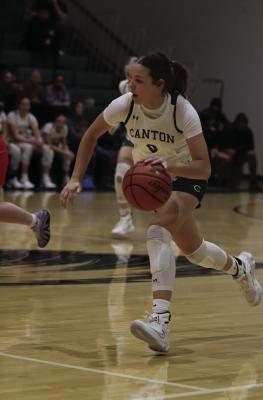 Addison Capps of the Canton Eaglettes drives down the court during a home game against the Kemp Yellowjackets. The Eaglettes have taken over first place in district play as they prepared to take on the Brownsboro Bearettes Jan. 20. Results of the game were not known at press time. Courtesy photo