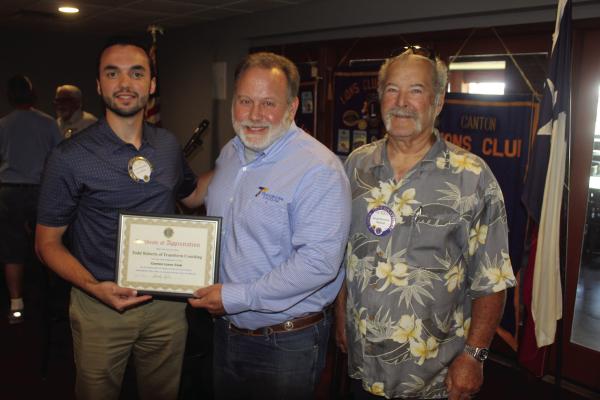 Following his presentation at the weekly Canton Lions Club Luncheon July 23 at Van Zandt Country Club, Todd Roberts, Founder of Transform Coaching, middle, was presented with a ‘Certificate of Appreciation’ from the Canton Lions Club. Presenting Roberts with the ‘Certificate of Appreciation’ were Canton Lions Club First Vice-President Doug Harrison, right, and Canton Lions Club Second Vice-President Darren Bashinski. Photo by David Barber