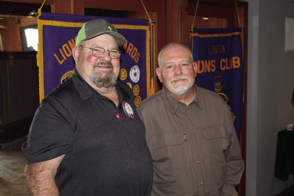 The weekly Canton Lions Club Luncheon March 18 featured Love and Grace Family Resource Center of Canton Director Dwayne Clements, right, as their guest speaker. Standing with Clements was Canton Lions Club President Sandy Sims. Photo by David Barber