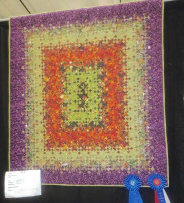 MonicaAnthony’s ‘Blooming Patch’won a Blue Ribbon and the Best of Small Quilts Award.