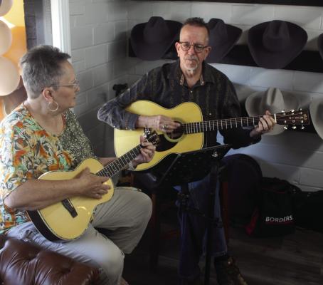 Mark and Susan Smith of Dallas provided musical entertainment Aug. 2 during the ribbon-cutting event for Boho and Arrows Décor Studio/Brick and Brim in Canton. The businesses are located at 151 East Terrell Street. Photo by David Barber