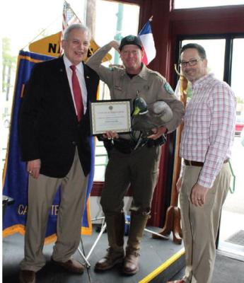 Photo by Susan Harris A ‘Certificate of Appreciation’ was presented to Van Zandt County Northeast Texas Game Warden Captain Steve Stapleton (middle) by Canton Lions Club President Jonathan Helvey (right) and Canton Lions Club Member Andy Reese. Stapleton was the guest speaker April 30 during the weekly Canton Lions Club Luncheon.