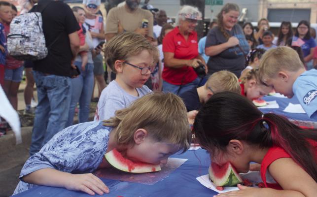 Four age divisions were featured in the annual Watermelon Eating Contest on the Fourth of July in downtown Canton. Other downtown activities featured the bicycle decorating contest and the parade as those in attendance enjoyed unseasonably cool, cloudy weather conditions during the morning events. Later in the day, a car show followed by an impressive fireworks display lit up the night sky to wrap up the holiday activities. Additional photos on 10A. Photo by Susan Harris