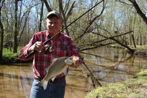White bass (sand bass) are fun to catch and great eating. Here’s Luke with a ‘bigun’ that landed during the early spring spawn. Catching is fast and furious now on many area lakes. Photo by Jeff Rice
