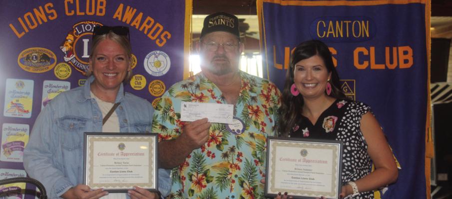 Canton Lions Club President Sandy Sims, middle, presented a donation check and ‘Certificates of Appreciation’ to Brittany Tarno and Brittany Sumner as they discussed the annual Canton Elementary School Pumpkin Patch Fundraiser. The two speakers were present during the weekly Canton Lions Club Luncheon Sept. 17 at Van Zandt Country Club. Photo by Susan Harris