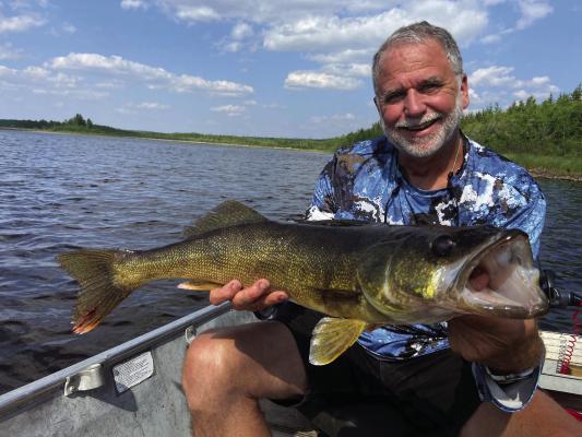 Jeff Rice shows off one of many big walleye landed on the last trip. Photo by Luke Clayton