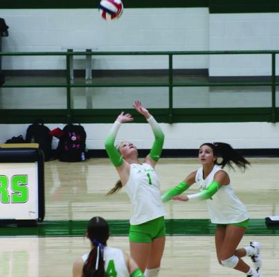 Jordyn Marker (#1) sets the ball during the district match in Mabank between the Panthers and the Canton Eaglettes on September 11th. Photo by Blaine Clamon