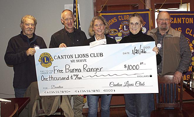 At the conclusion of their weekly luncheon Jan. 21 at Van Zandt Country Club, the Canton Lions Club announced a donation check totaling $1,000.000 for Free Burma Rangers. Medical Missionary and Founder of Free Burma Rangers Dr. Bruce Woodall, second from left, was the guest speaker. Standing with Woodall were left to right, Canton Lions Club Member Doug Harrison; Woodall’s wife, Dale; Canton Lions Club Member Anna McDaniel, and Canton Lions Club President Sandy Sims. Photo by David Barber