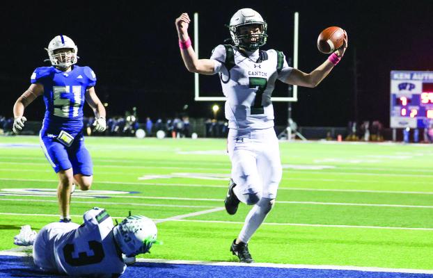 The Canton Eagles improved their season record to 8-0 and their District 6-4A, Division 2, mark to 2-0 as they blew past the Wills Point Tigers, 63-7, Oct. 17 in Wills Point. Eagle quarterback Cort Ray, top photo, crosses the end zone on a touchdown run. Reserve QB Cason Kuhn, bottom photo, fights off a Wills Point tackler as he tries to game yardage on a running play. Photos by Don Johnson