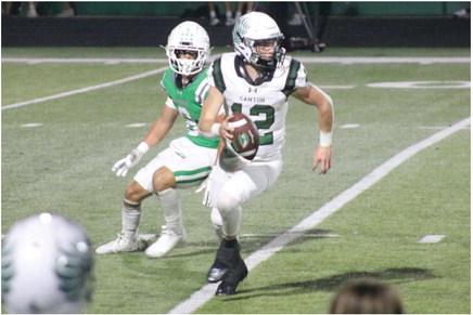 Canton Eagle quarterback Nathan Parker (12) runs with the ball on this play during action against the Mabank Panthers Sept. 15. Canton outlasted Mabank, 29-9, to finish non-district play at 2-2. The Eagles will host Center for Homecoming in a 7:30 p.m. kickoff Sept. 22. Photos courtesy of Blaine Clamon