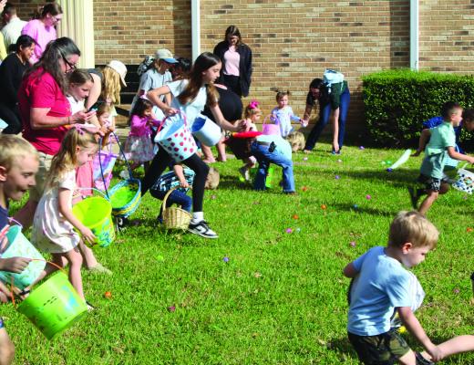 Around 60 children participated in the Annual Easter Egg Hunt March 26 on a near perfect weather day at the Van Zandt County/Sarah Norman Library in Canton as they scooped up over 1,000 eggs on the library property. Before and after the Easter Egg Hunt, the children were able to view some live rabbits inside the Buchanan Room at the library. Additional photos on 2A. Photo by David Barber