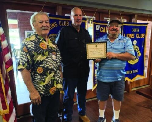 Retired Texas Ranger and Texas Department of Public Safety (DPS) Trooper Kenny Ray, middle, received a ‘Certificate of Appreciation’ following his presentation during the June 3 Canton Lions Club Luncheon. Presenting the certificate were Canton Lions Club President Sandy Sims, right, and Canton Lions Club Vice-President Doug Harrison. Photo by Terrie Harrison