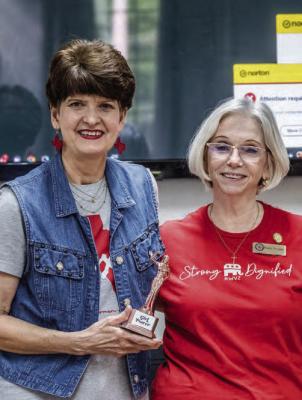 Debbie Burden (left) was honored with the ‘Girl Power’ award for the first quarter of 2024 by the Republican Women of Van Zandt during a recent meeting. Presenting the award is Rocky Norman of the Republican Women of VZ. Courtesy photo