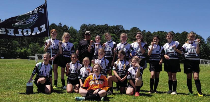 The Canton Eagles “Green” FC U-12 team topped the field at the Mike Mendicello Tournament in Longview April 16, winning first overall. Team members and coaches include: (top row, l-r) L.Taylor, B.Hipp, Coach Al, B. Rodgers, C. Ervin, P. Nations, K. Tull, A. Leos, K. Troxell, A. Stout, (middle row, l-r) K. Kittrell, A. Zarate, H. Boyd, J. Ringer M. Jay, M. Jenkins and (bottom row) H. Telschow. Courtesy photo